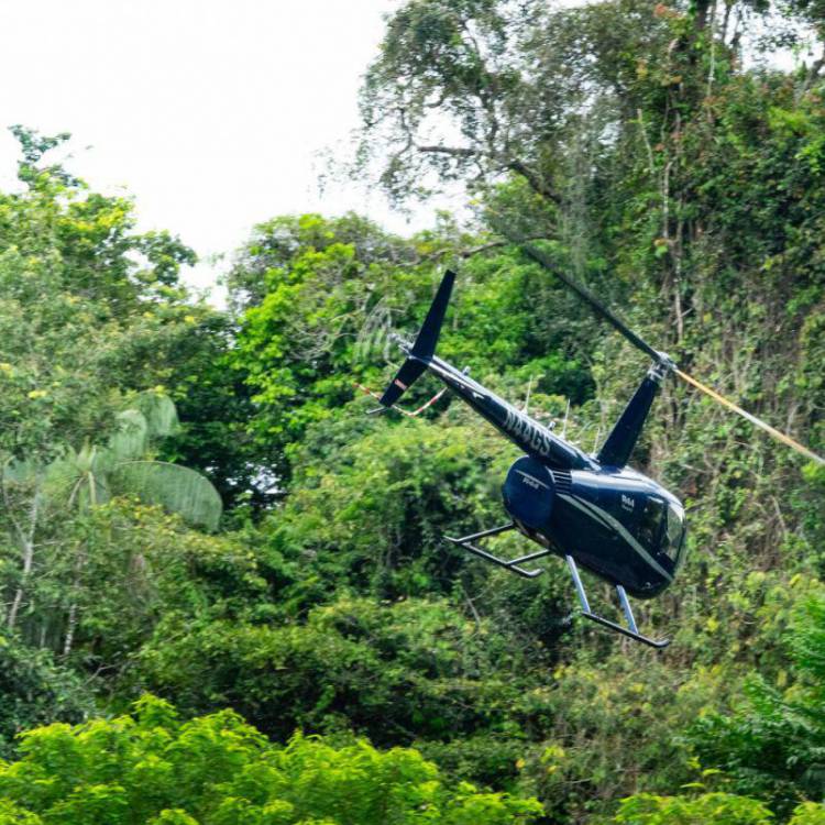 A helicopter after dropping Ash Dykes and his team into the Suriname jungle