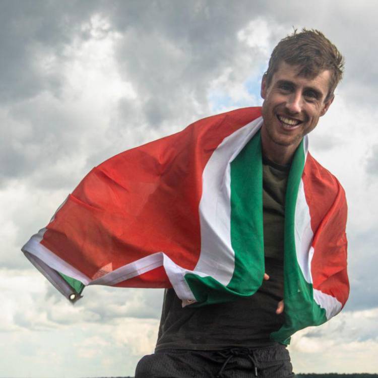 Ash Dykes draped in the Suriname flag