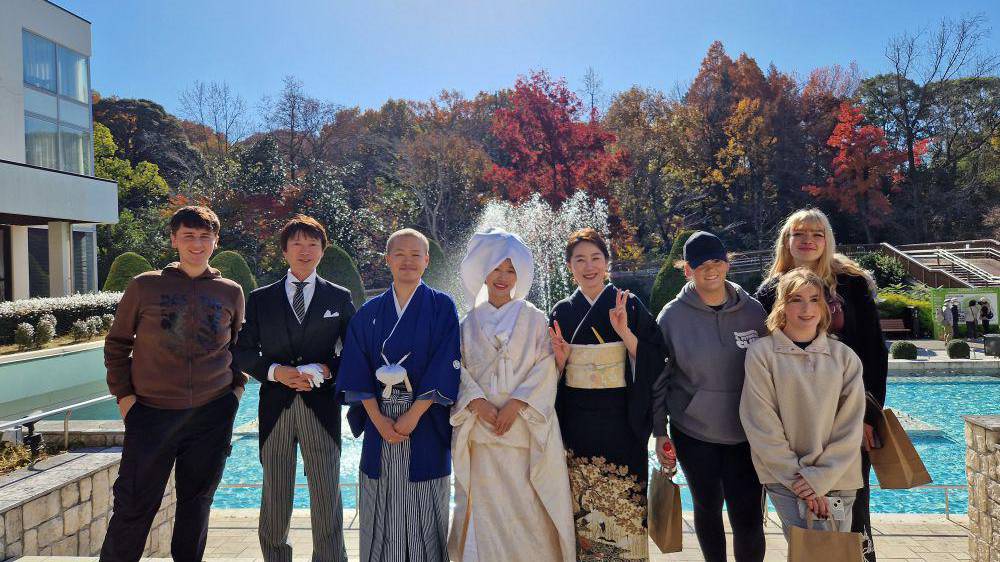 Coleg Menai learners with actors in a mock wedding at Higashiyama Zoo and Botanical Gardens