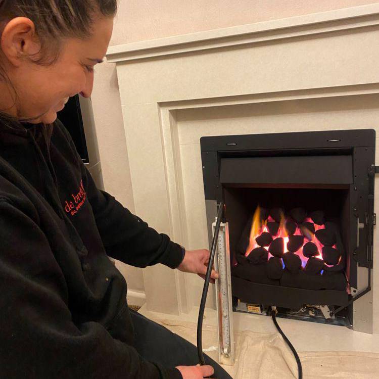 Francesca Giacomet working on a fireplace