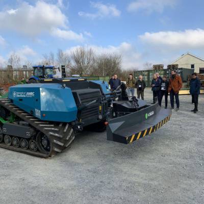 Members of the Agri-Tech Cymru Cluster watching a demonstration of the AgBot, a fully autonomous tractor, at Glynllifon