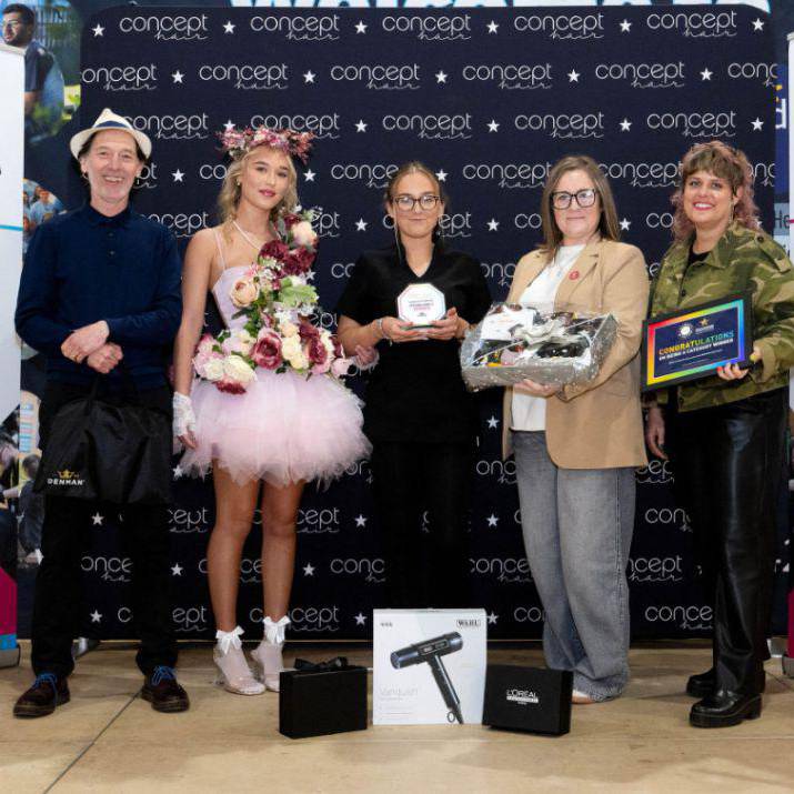 Kayleigh Blears holding her trophy with her model Gracie Calland and judges at the Concept Hair Learner of the Year UK final