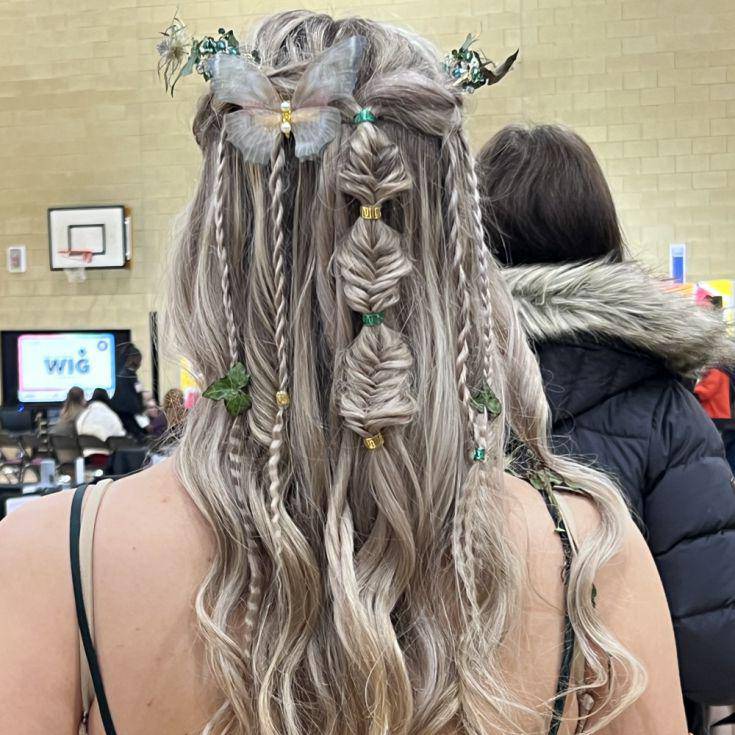 Harmony Wilson with her hair styled by fellow Coleg Menai student Brooke Williams at the Concept Hair Learner of the Year UK final