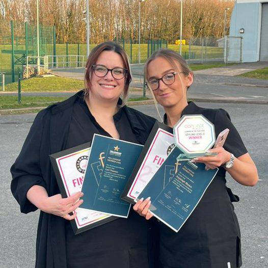 Ceri Thomas (left) and Kayleigh Blears with their certificates after competing in the Concept Hair Learner of the Year UK final