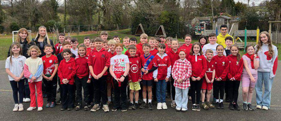 Coleg Meirion-Dwyfor students with children at Ysgol Abererch