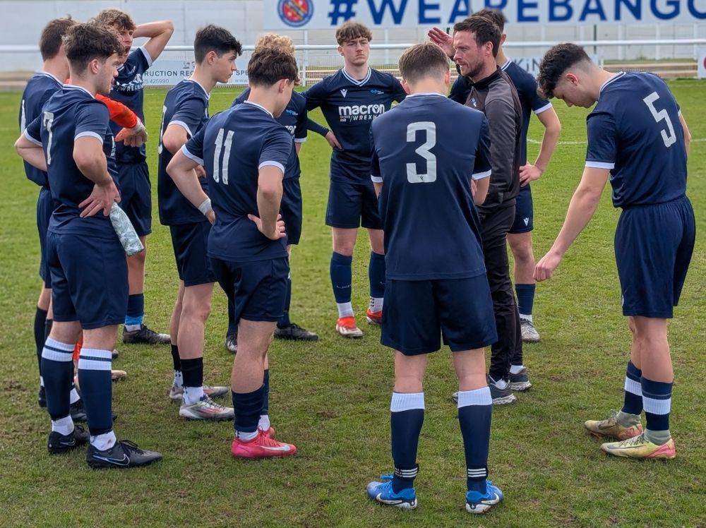 Head coach and sports lecturer Matthew Williams talking to Coleg Llandrillo's Football Academy team
