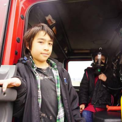 Children on board a fire engine at the 2024 community fun day in Dolgellau