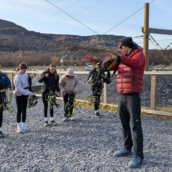 School students preparing to go on the zip wire at Zip World’s Penrhyn Quarry site