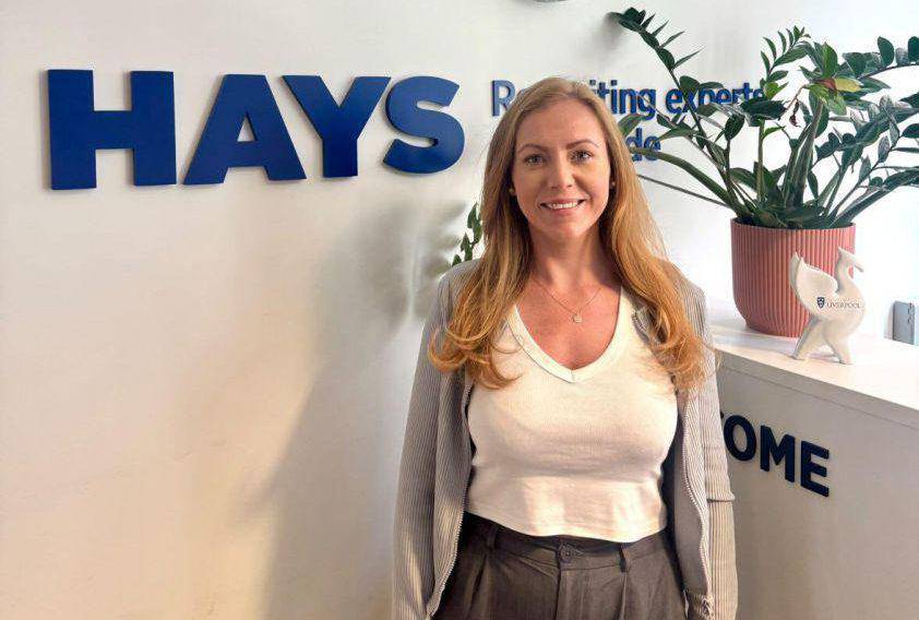 Former Coleg Menai student Ellie Granton in the office of Hays Recruitment