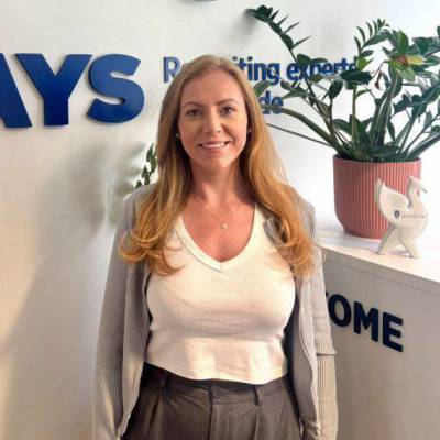 Former Coleg Menai student Ellie Granton in the office of Hays Recruitment