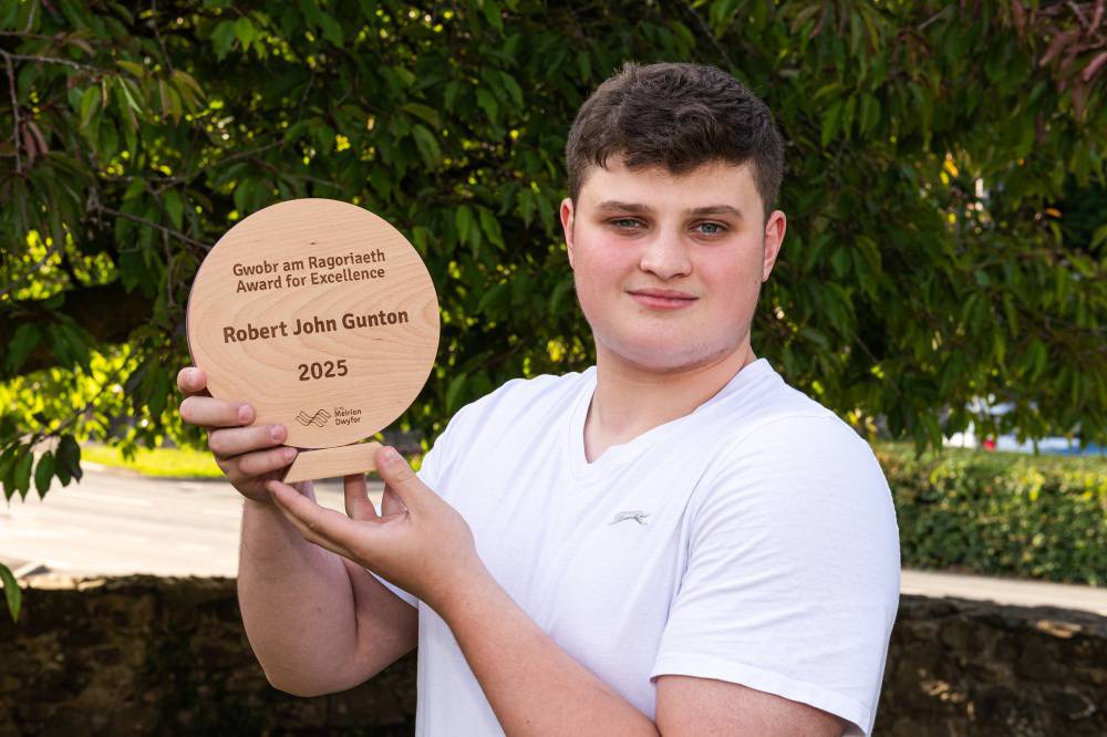 Coleg Meirion-Dwyfor student Robert John Gunton with his trophy at the 2024/25 Achievers’ Awards ceremony
