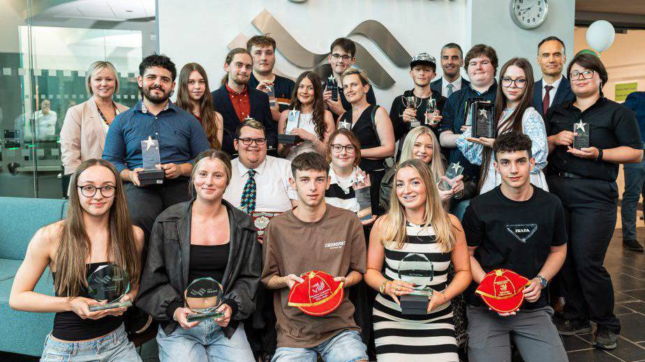 The winners of Coleg Menai’s 2024/25 Achievers’ Awards with their trophies
