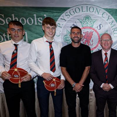 Osian Morris, Rhys Williams, Morgan Davies and Byron Davis with their Welsh Schools caps, with Angel Rangel and Marc Lloyd Williams