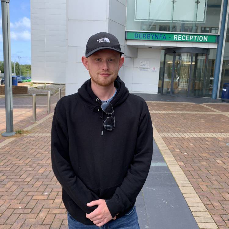 Sion Thomas outside Coleg Llandrillo