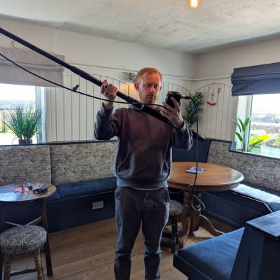 Sion Thomas operating a camera