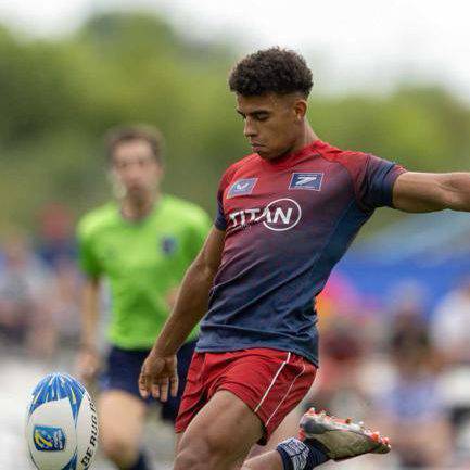 Caio Parry kicking the ball while playing for Great Britain Sevens