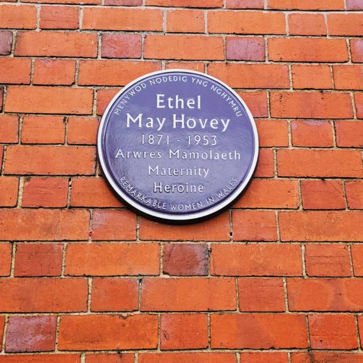 The Purple Plaque commemorating Ethel Hovey on the wall of the former Nant y Glyn maternity home which she founded