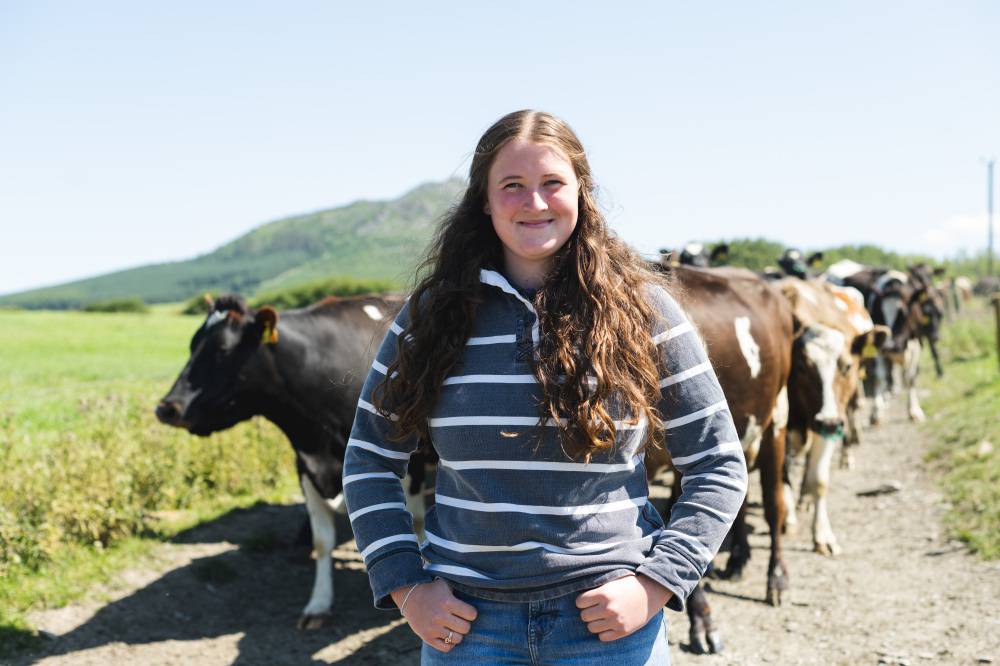 Glynllifon student Gwenllian Lloyd Davies in front of a herd of cattle