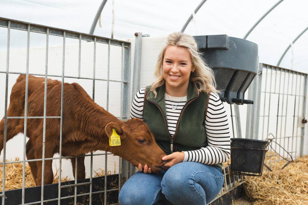 Glynllifon student Elin Wyn Williams with a calf