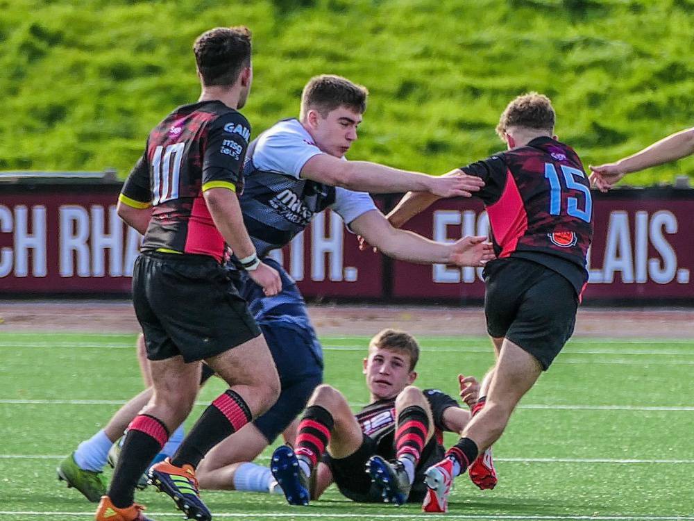 George Watkins making a tackle while playing for Coleg Llandrillo’s rugby team