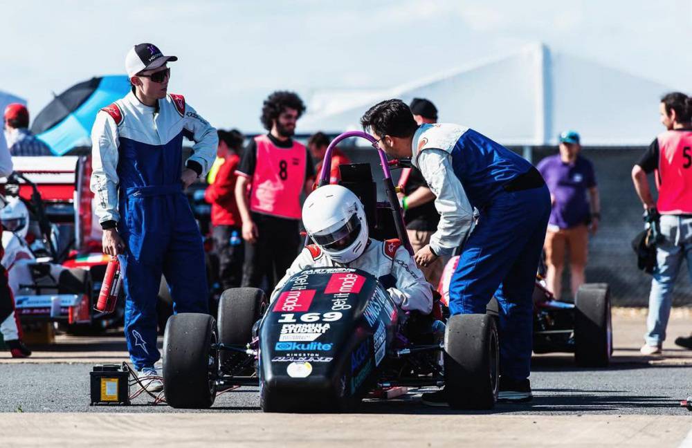 The driver and members of the pit crew with Kingston Racing’s Formula Student car