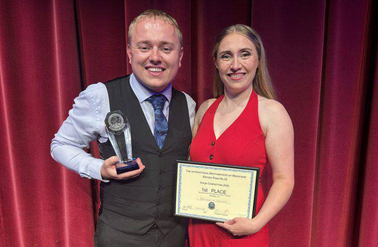 Dean Raymond and Kazia Cannon with their award and certificate after being named ‘Stage Magicians of the Year’