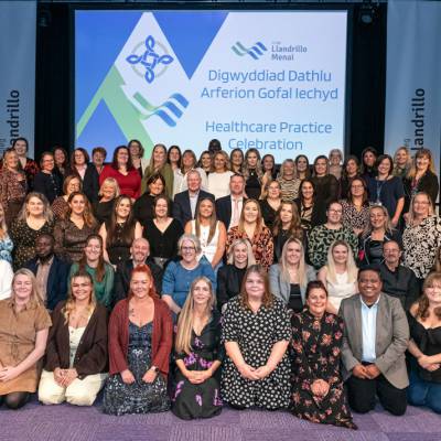 Learners celebrate achieving the Level 4 Certificate of Higher Education in Healthcare Practice at a ceremony in Venue Cymru