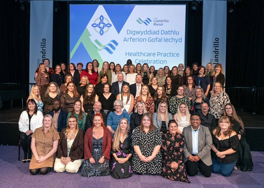Learners celebrate achieving the Level 4 Certificate of Higher Education in Healthcare Practice at a ceremony in Venue Cymru