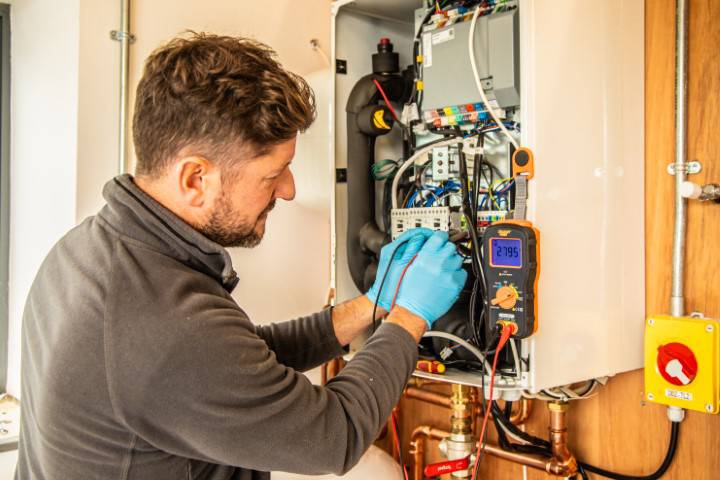 Man servicing a boiler