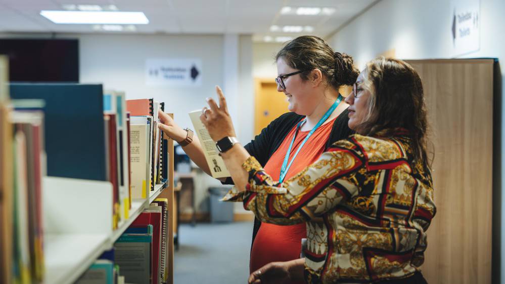 Learner getting advice and support in a library