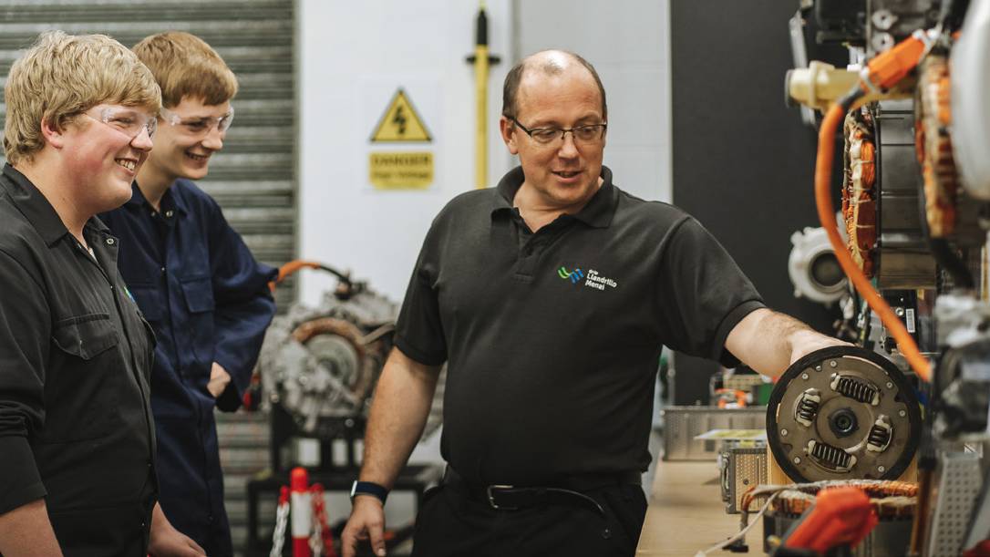 Teacher and students in a workshop