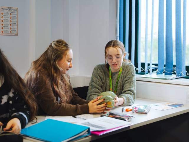 Two students discussing work