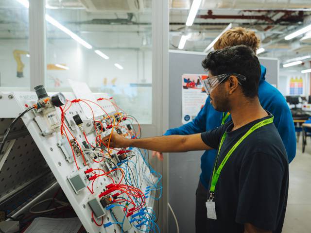 Engineering learners working on electrical circuits