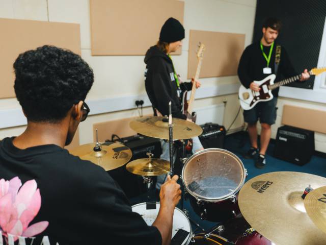 Music learners playing in a band