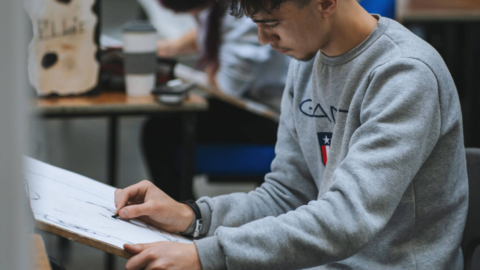 A student doing a drawing