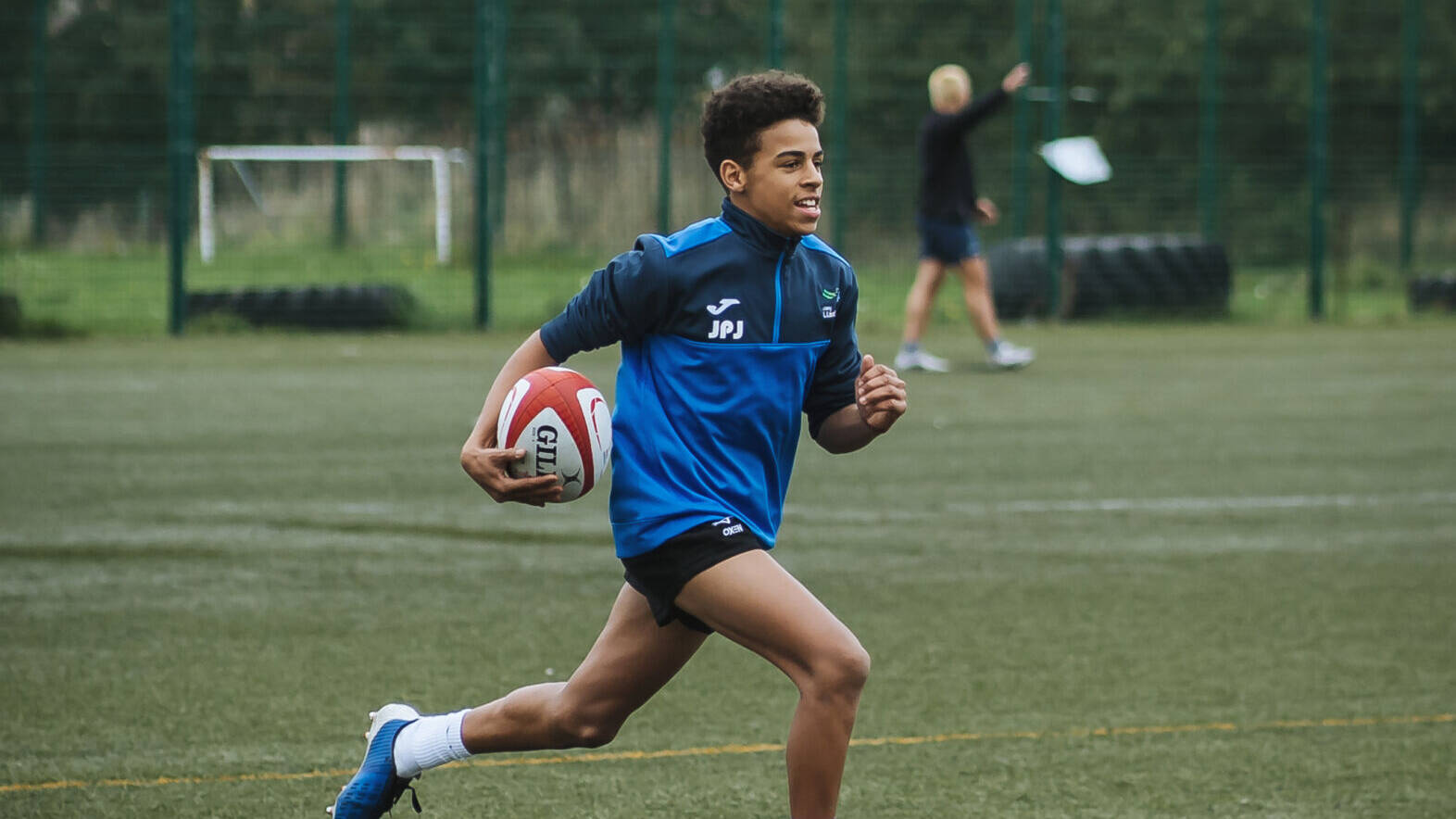 Student playing rugby
