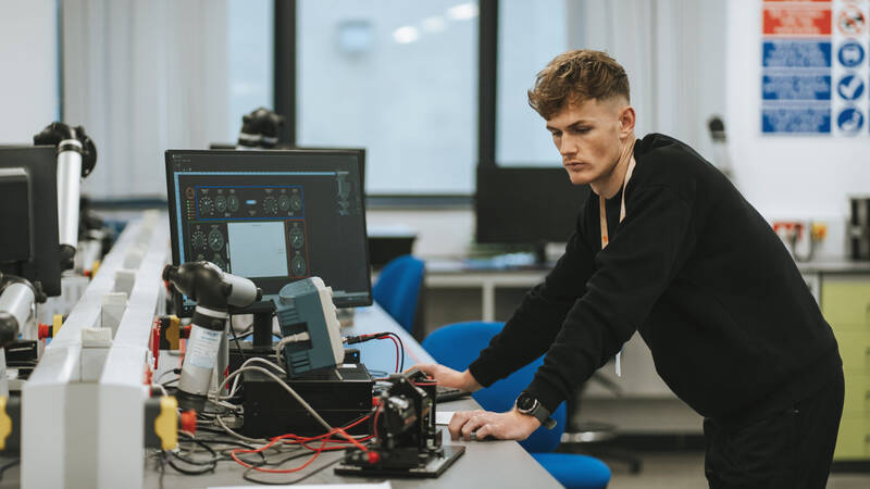 Student using electrical equipment