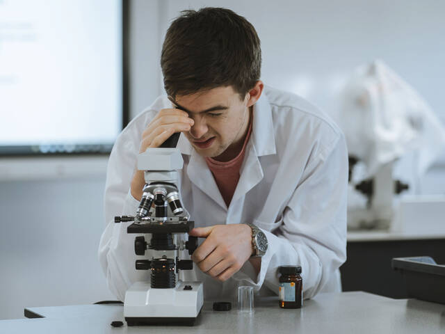 Pwllheli A-Level student using a microscope