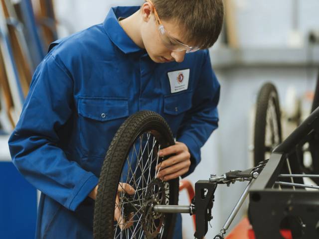 Student working on bike